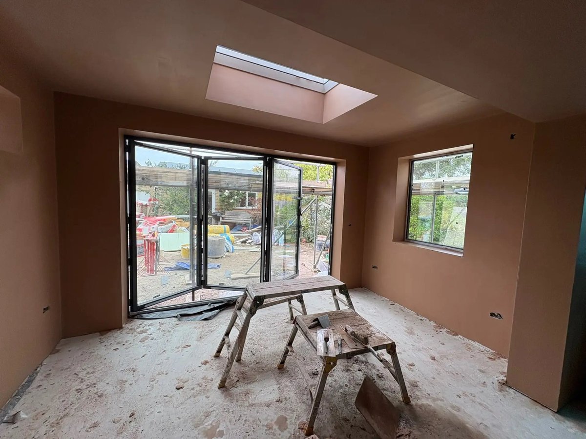 Freshly plastered extension with rooflight and bifold doors fitted, Willingham
