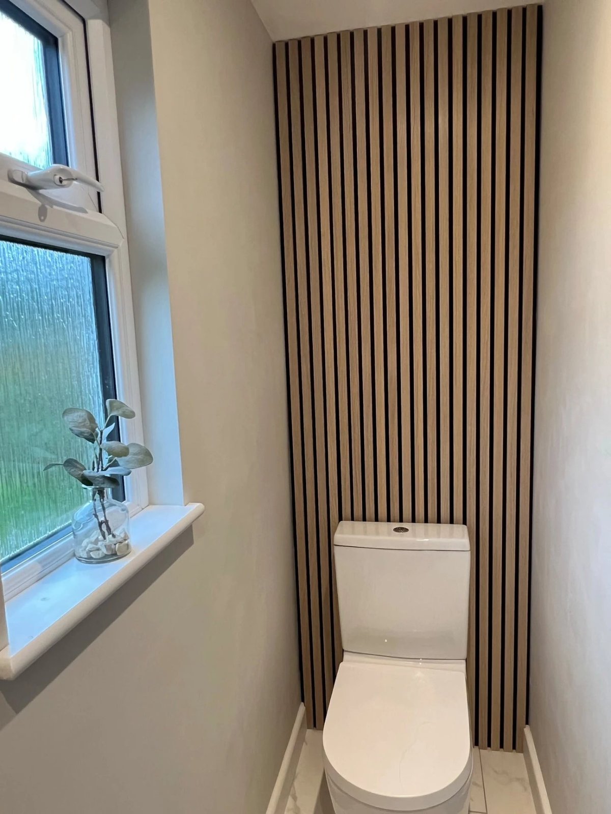 Cloakroom with oak slat feature wall and marble-effect tiled floor, Warboys