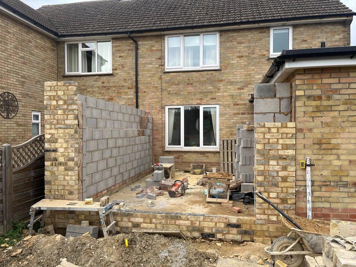 Rear extension walls under construction with brick piers and blockwork, New Road, Warboys