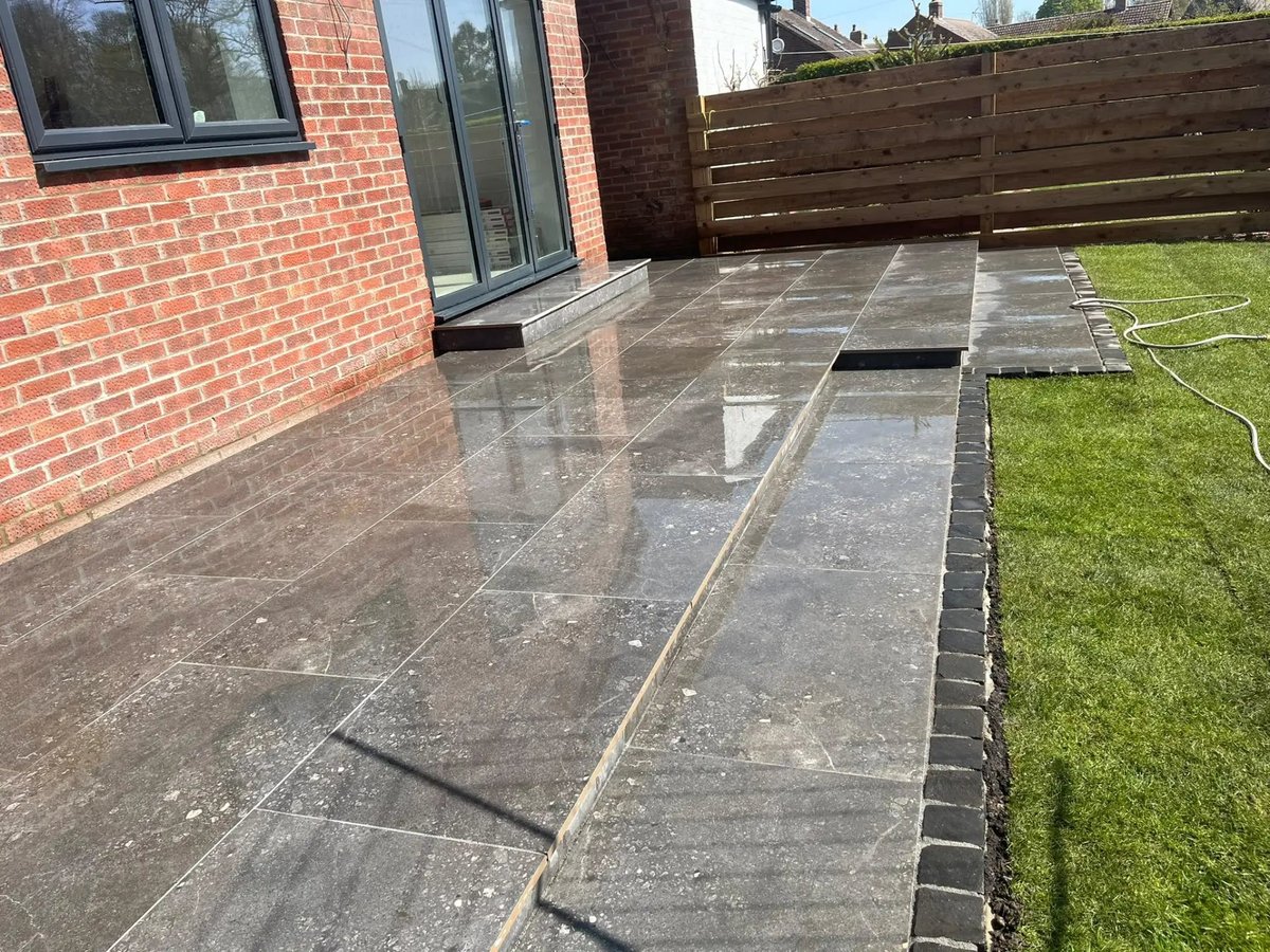 New porcelain patio with setts edging alongside the extension, Wyton