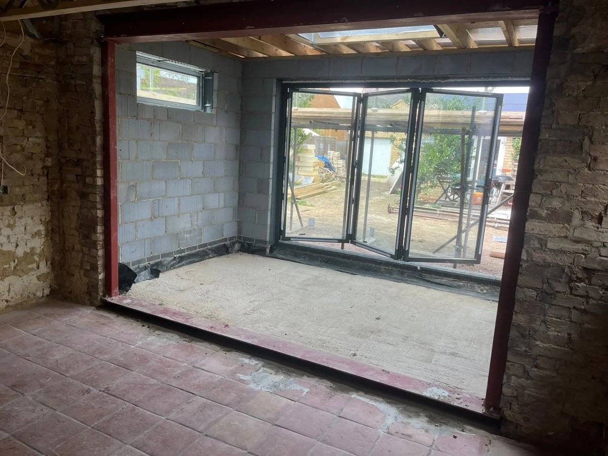 New bifold doors and steel-framed opening linking house and extension, Willingham