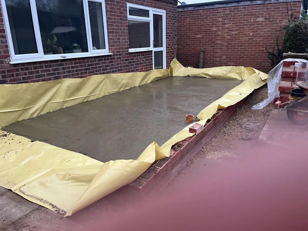 Poured concrete slab over damp-proof membrane for the extension, Wyton