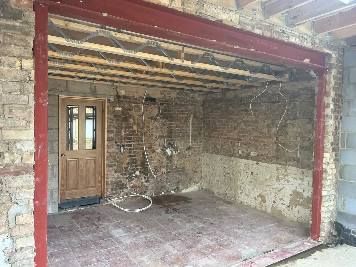 Steel beam and posts installed to open up the rear of the house, Willingham