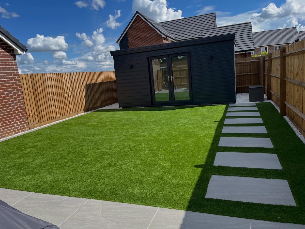 Completed dark-clad garden room built in a landscaped rear garden