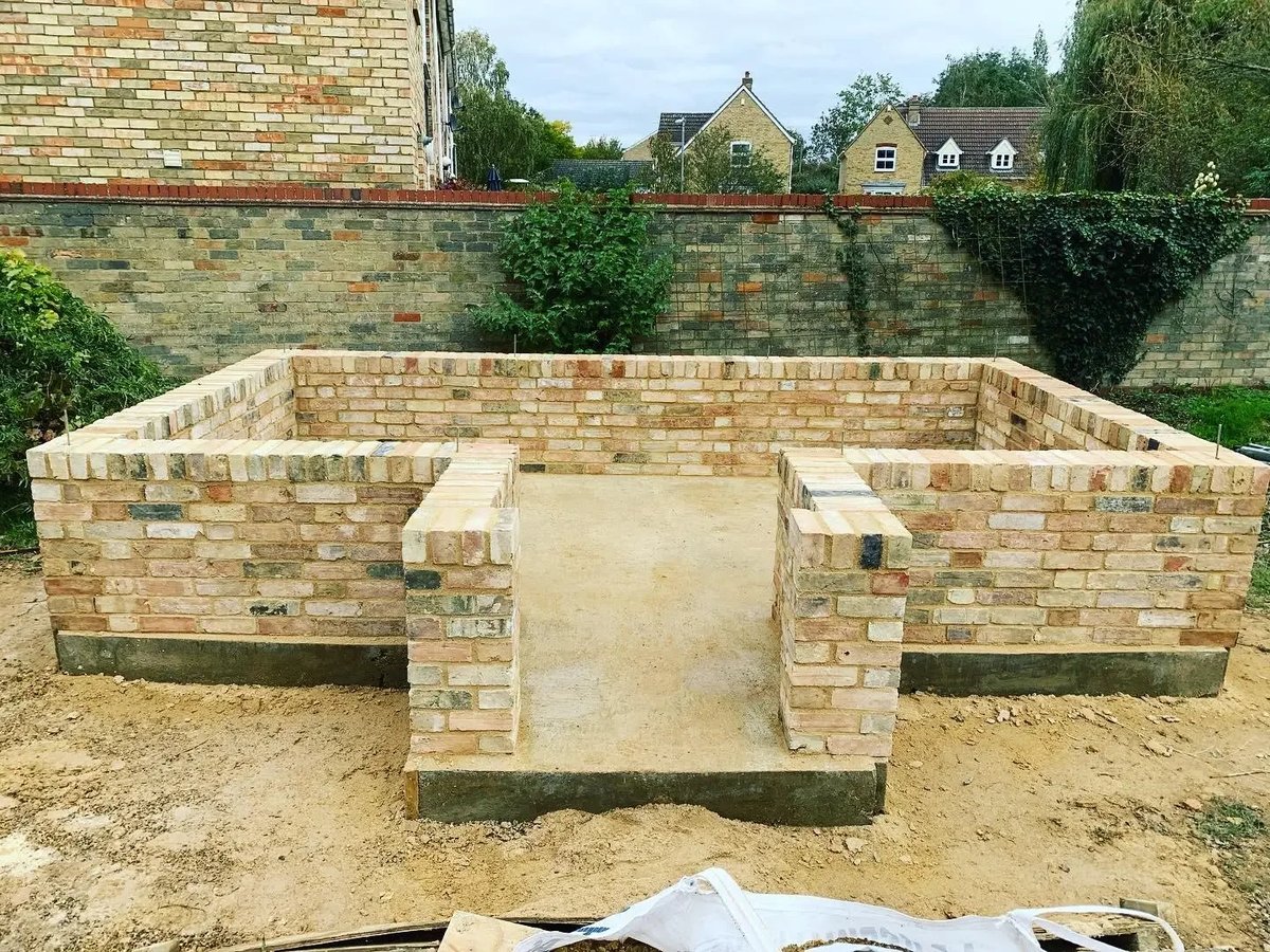 Low brick walls completed for a small outbuilding during construction