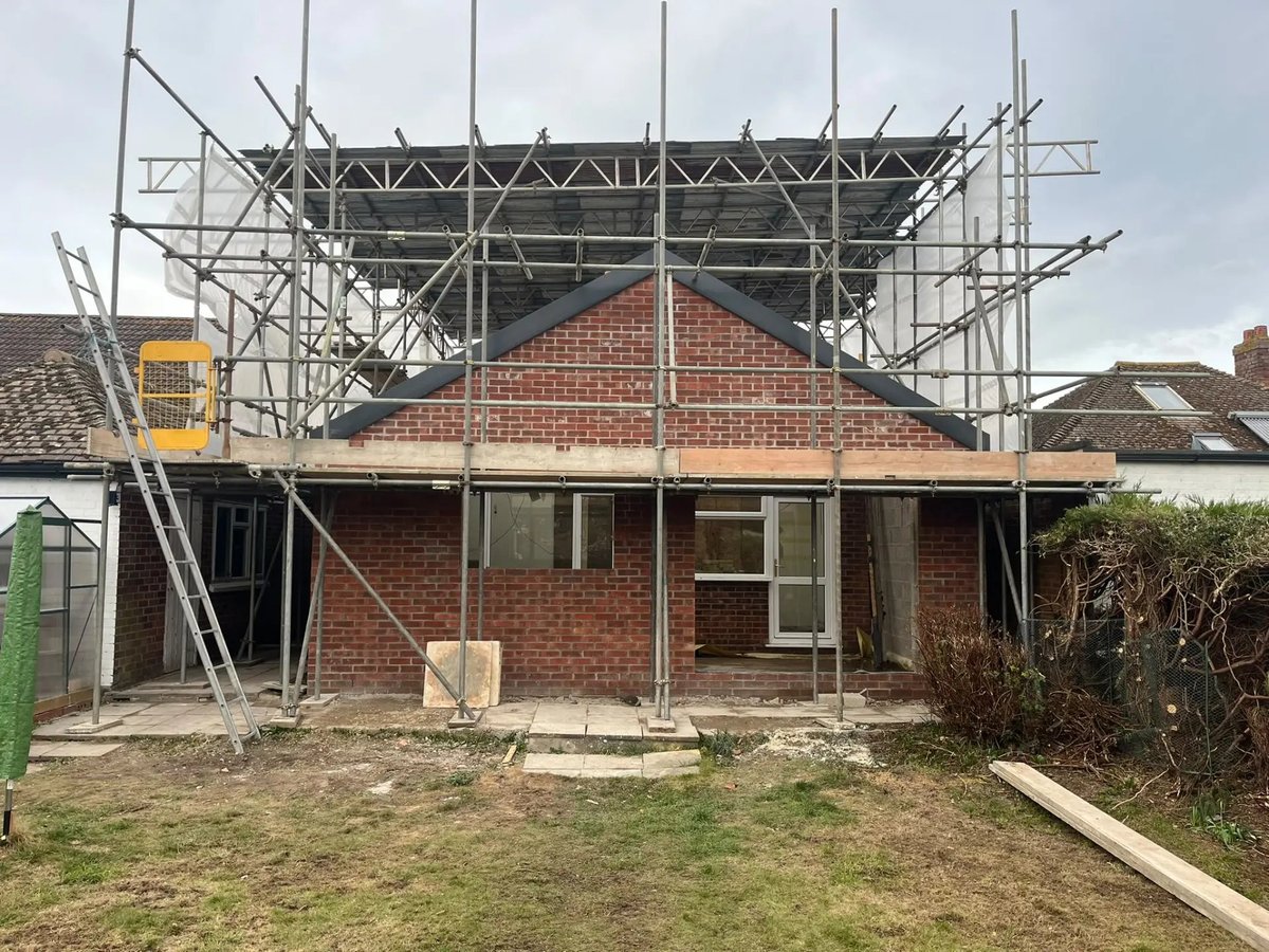 New gable and roof structure being built under full scaffold, Wyton