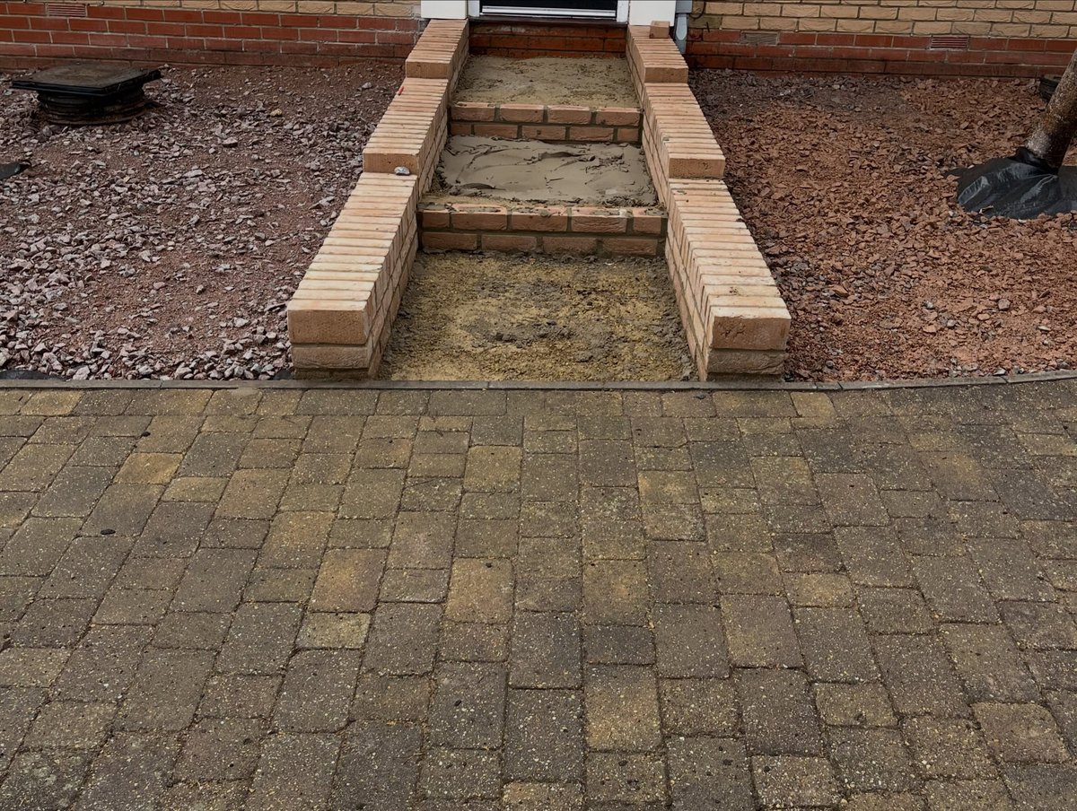 Front garden renovation during construction with walls being built