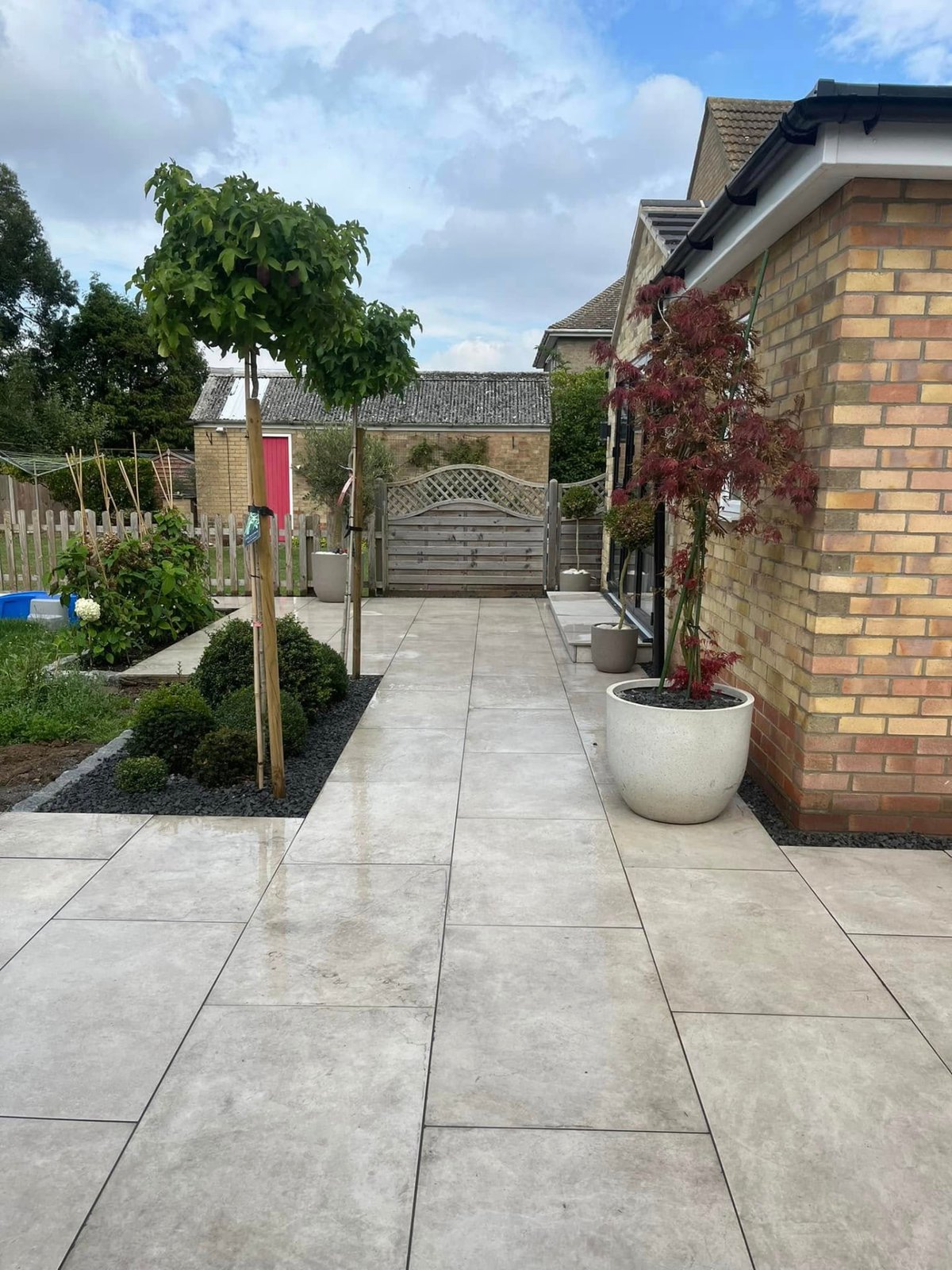 New porcelain patio and steps finished to the rear of a home