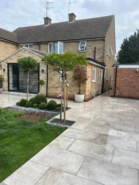 Porcelain paving patio with tight joints and level falls, St Neots