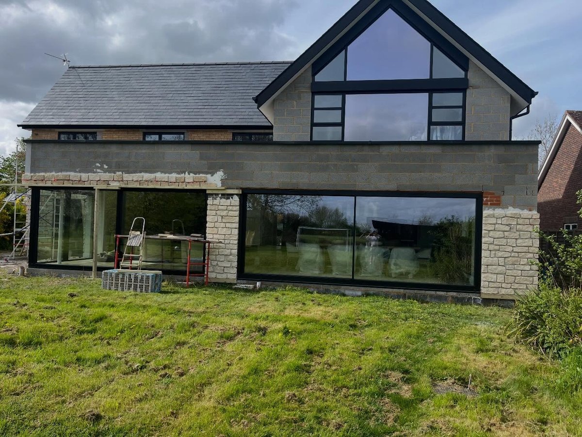 Stone cladding part way through installation on a Cambridgeshire property