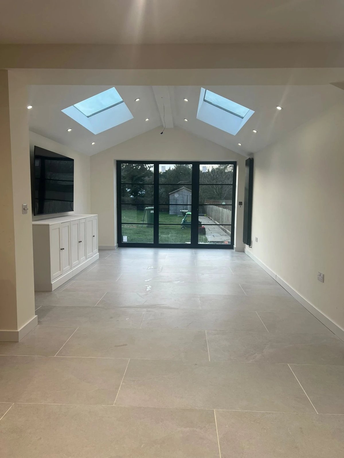 Finished extension room with large stone-effect tiled floor and garden doors, Warboys