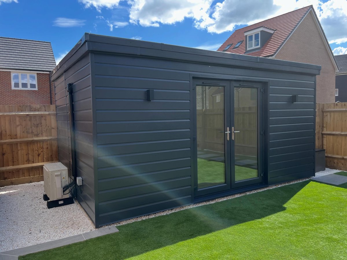 Finished garden room set on a paved base in a Cambridgeshire garden