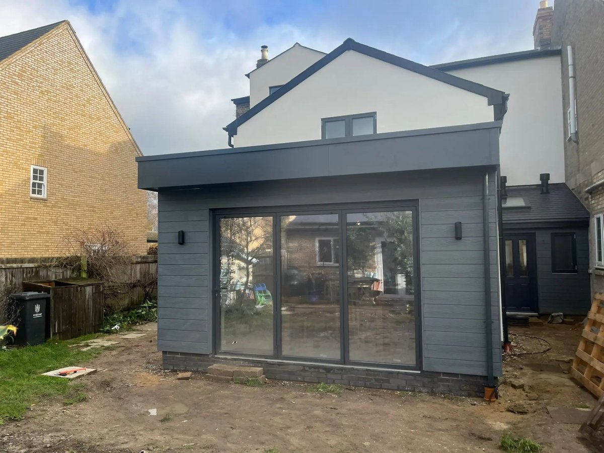 Finished rear extension and rendered house from the garden, Willingham