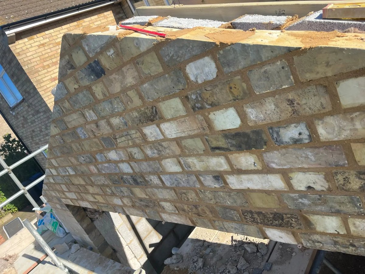 Reclaimed-look facing brickwork and insulated cavity on the extension gable, Warboys