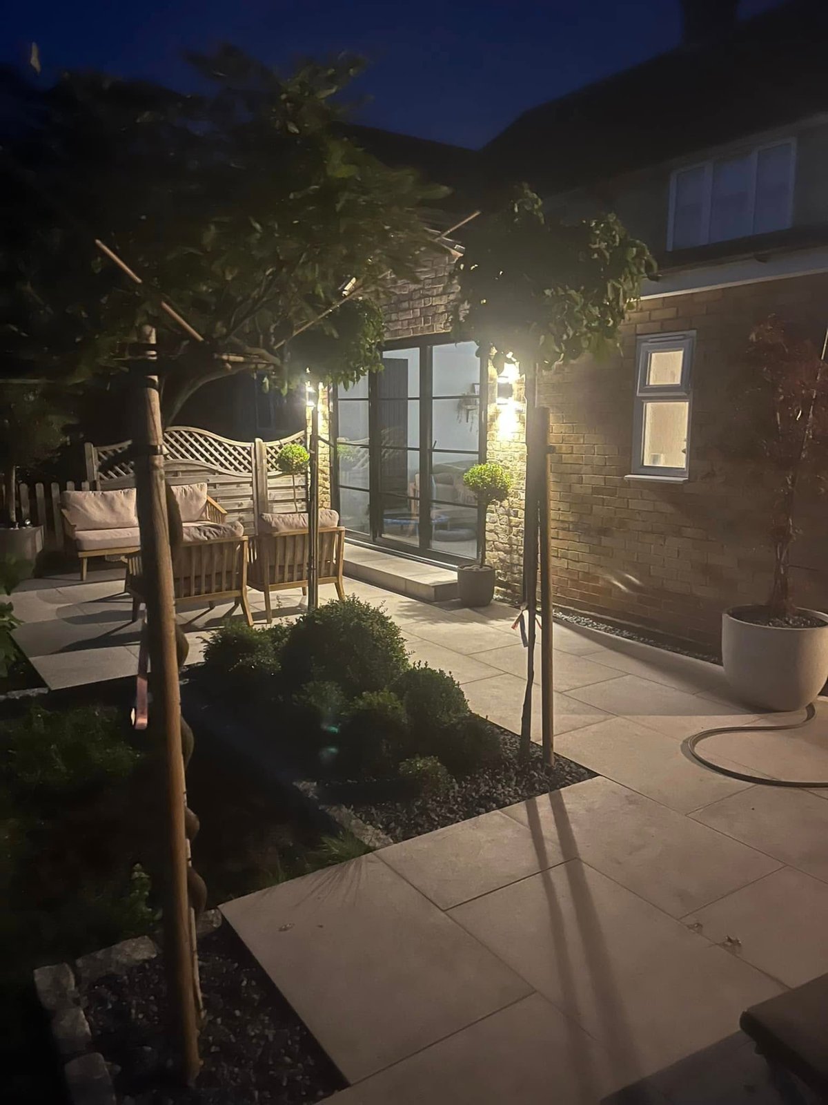 Garden landscaping finished with lawn, paving and boundary fencing