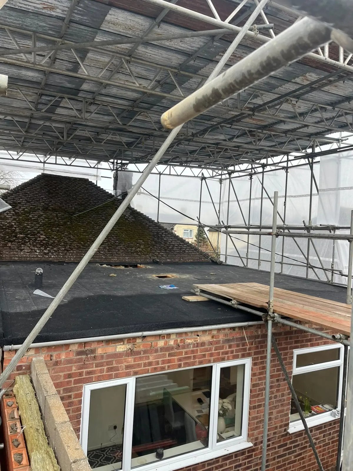 Felted flat roof completed under temporary scaffold cover, Wyton