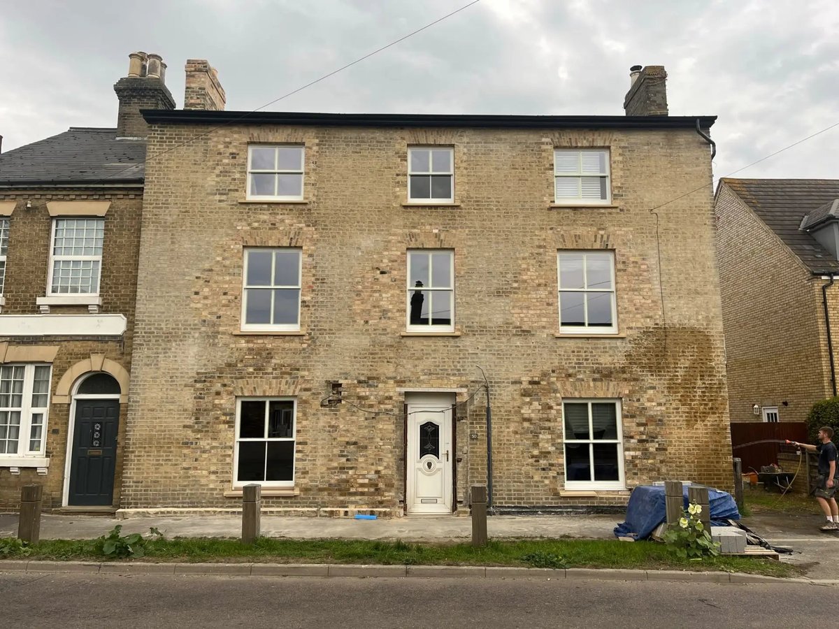 Restored gault brick front elevation with new sash windows and stone cills, Willingham