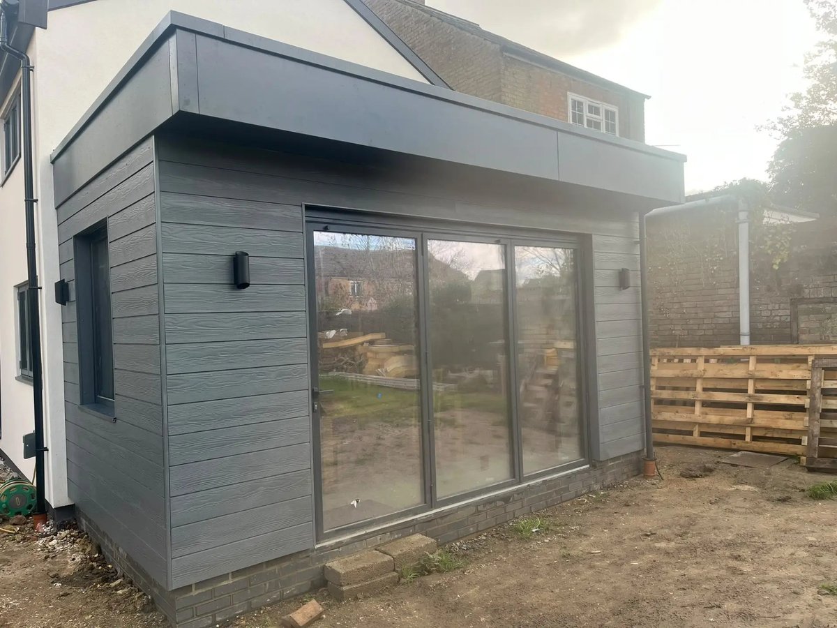 Completed rear extension with grey cladding and full-height sliding doors, Willingham