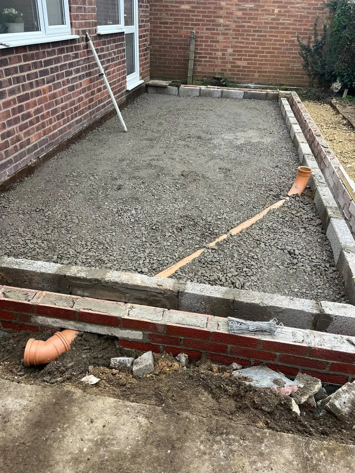 Hardcore base and brick footing walls set out for the new extension, Wyton