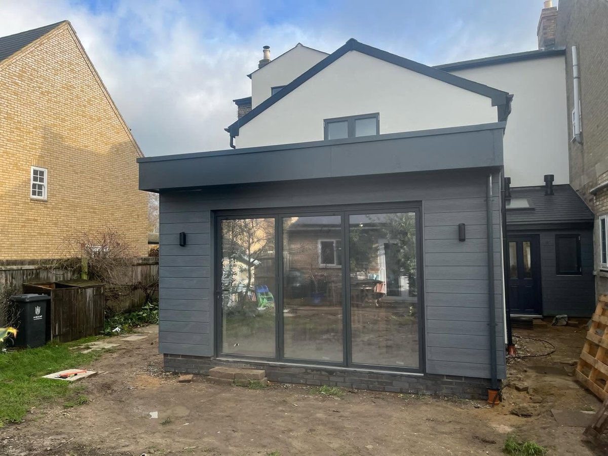 Finished single-storey house extension exterior with new roof and glazing, St Neots