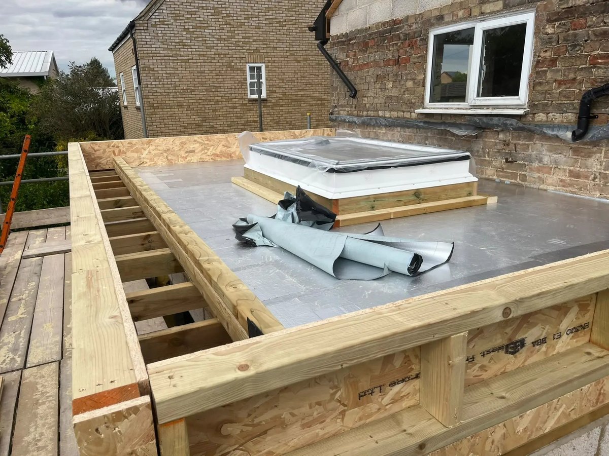 Insulated flat roof deck with rooflight upstand ready for covering, Willingham