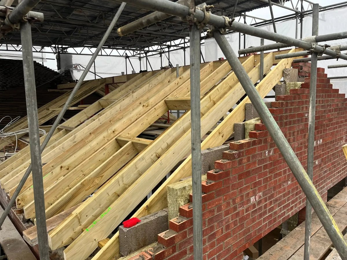 New pitched roof timbers and rafters set on the extension gable, Wyton