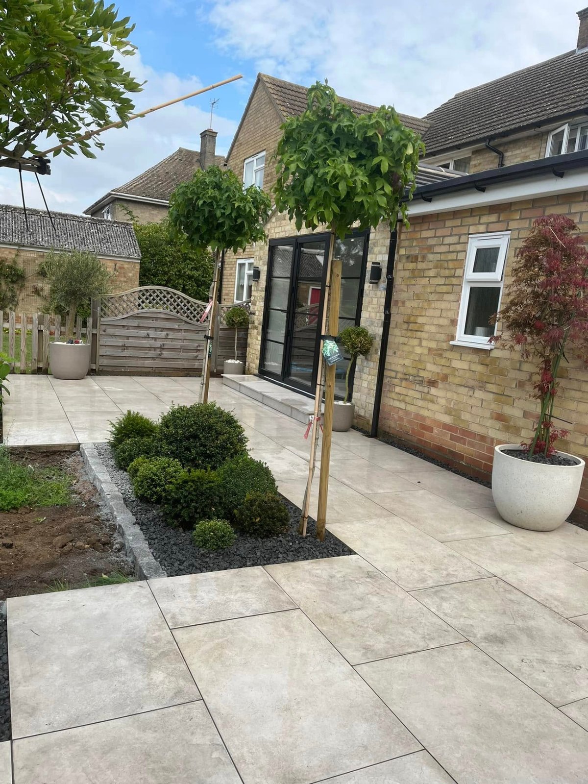 Completed porcelain patio seating area with edging detail