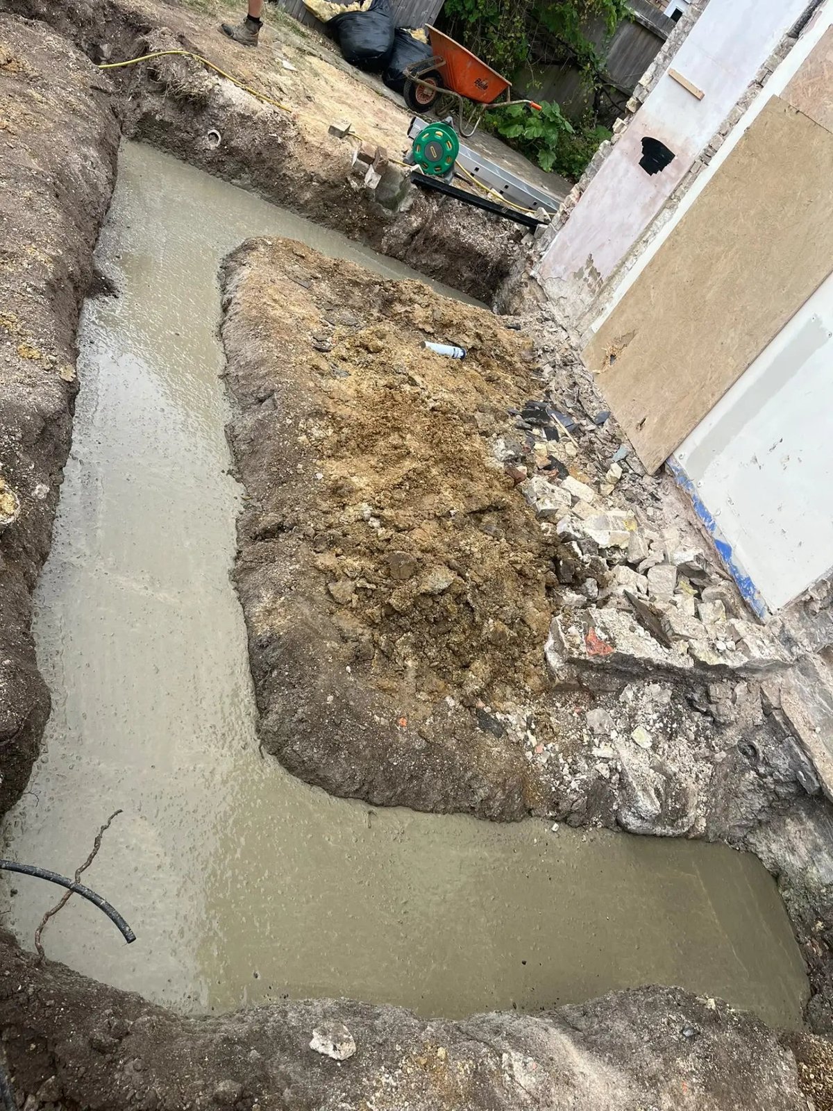 Poured concrete strip foundations for the rear extension, Willingham