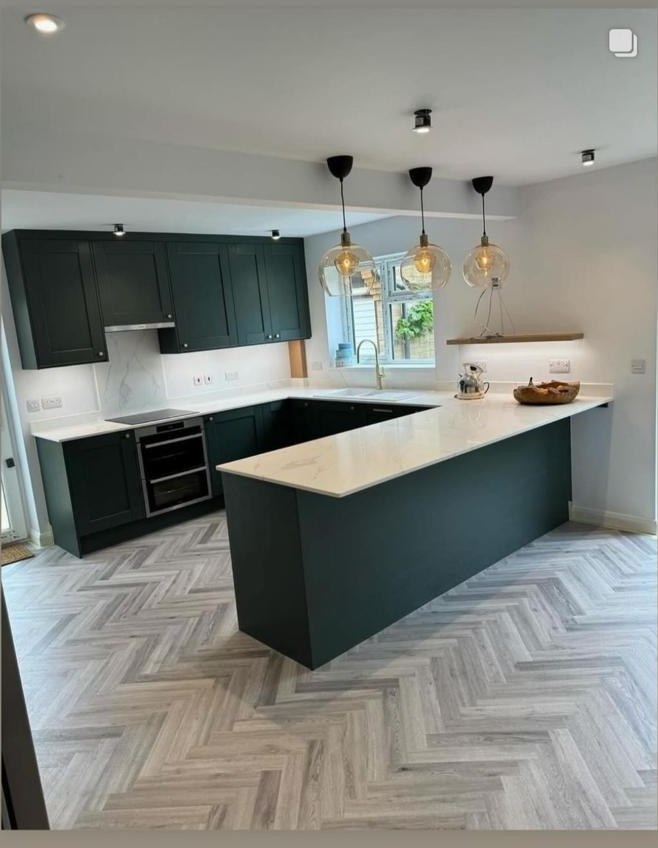 Dark green shaker kitchen with quartz worktops and herringbone flooring, Prime Build Services kitchen fitting