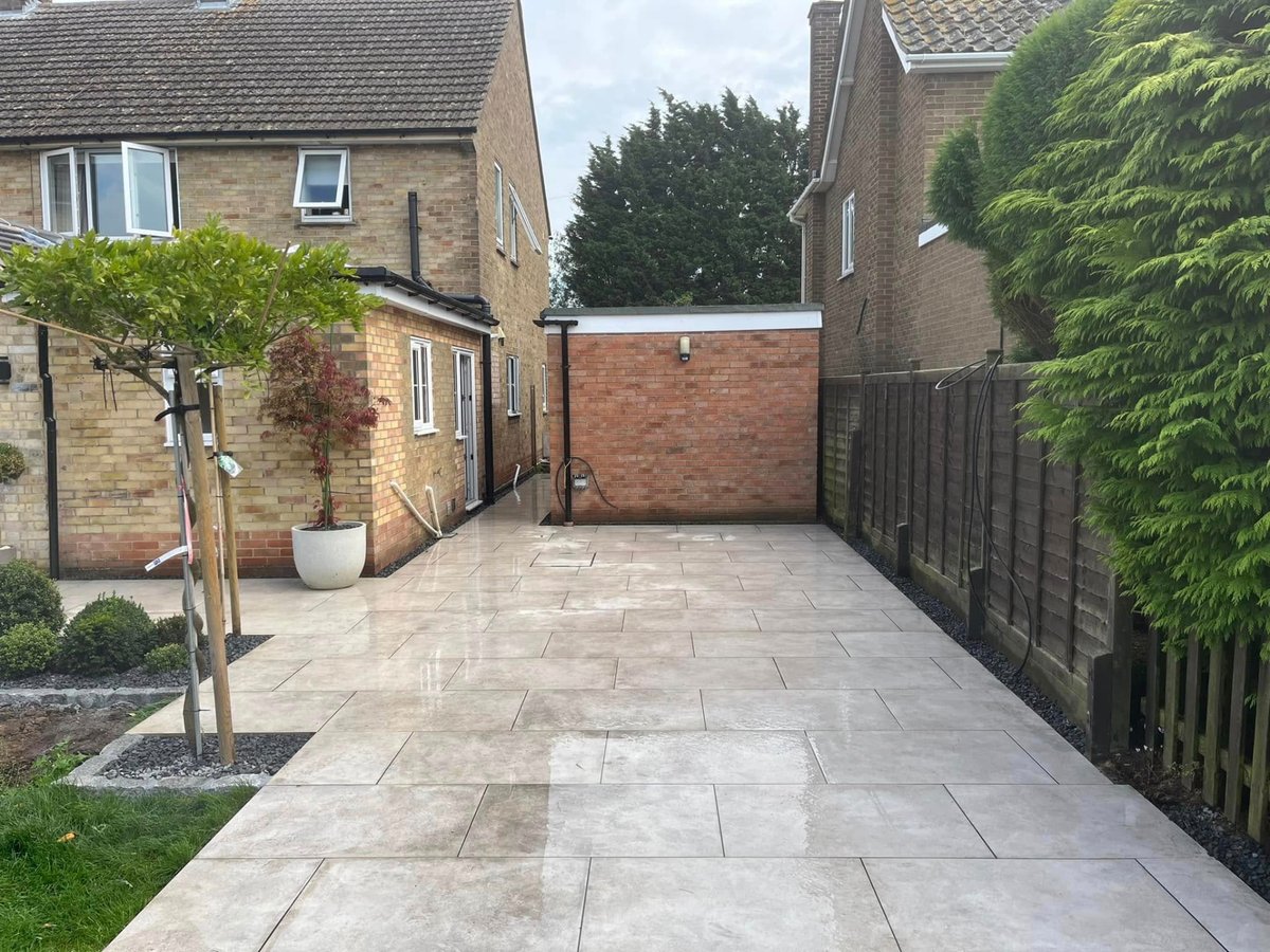Porcelain paving path providing side access along a property