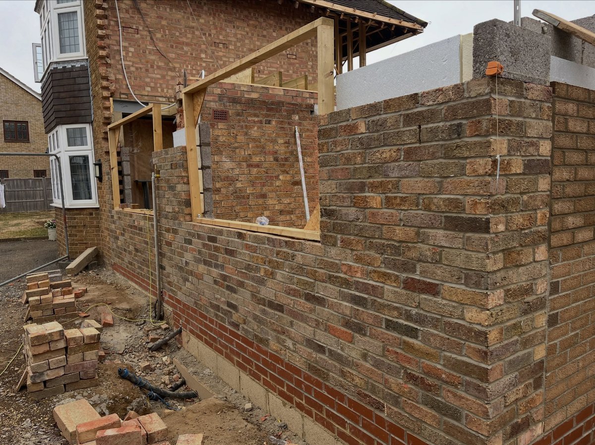 Extension brickwork outer skin and timber framing going up on a Cambridgeshire build