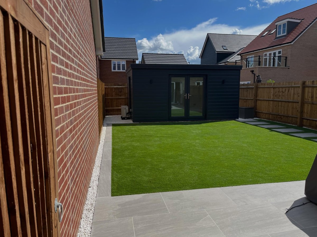 Garden room exterior with timber cladding and glazed doors