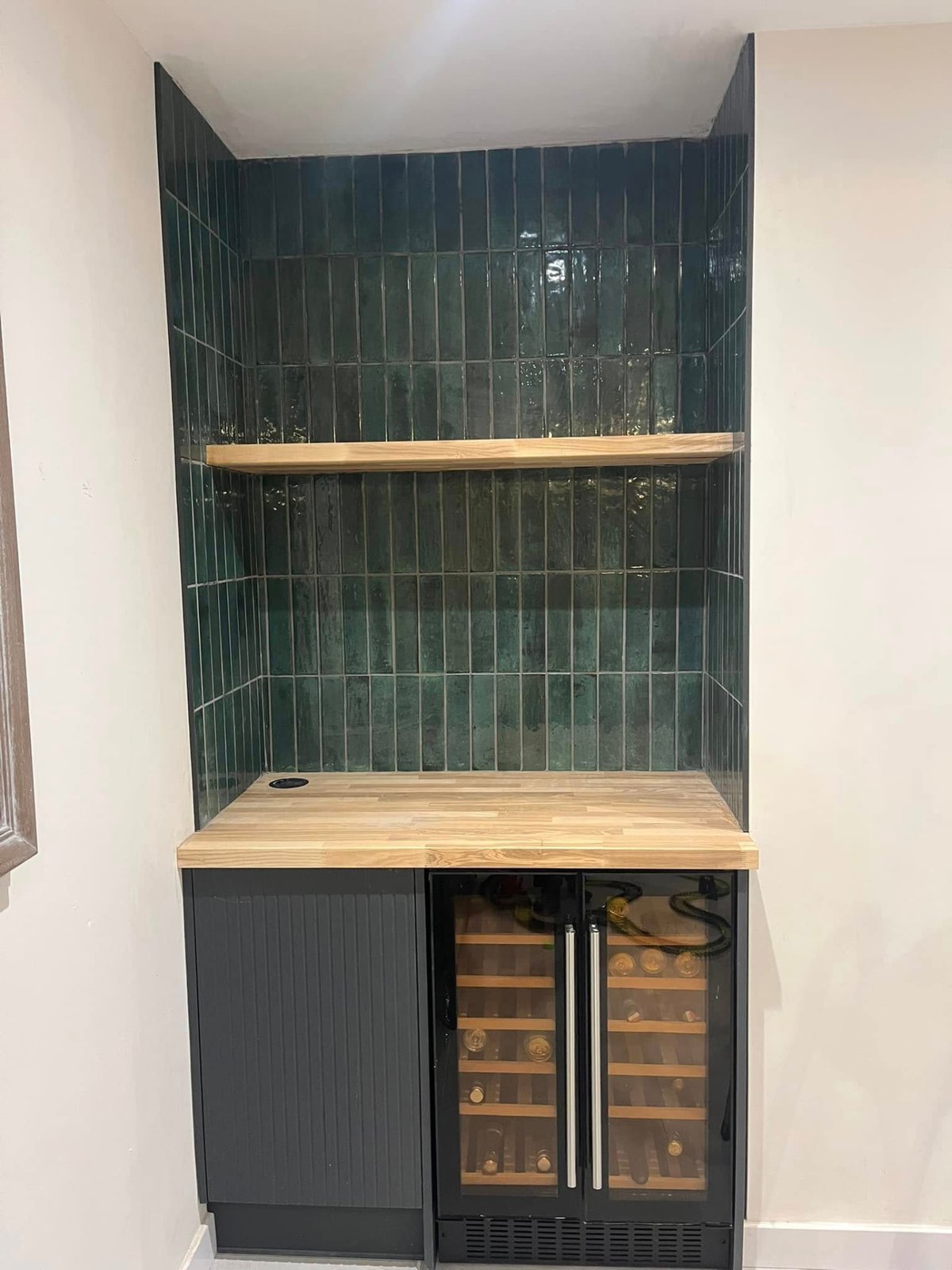 Bespoke dark green drinks bar built as part of a home renovation in Cambridgeshire