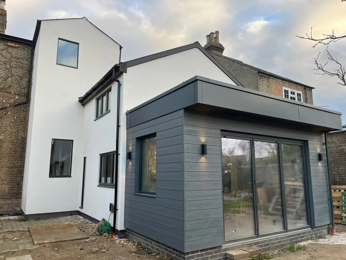 Completed extension corner with grey cladding, downlights and sliding doors, Willingham