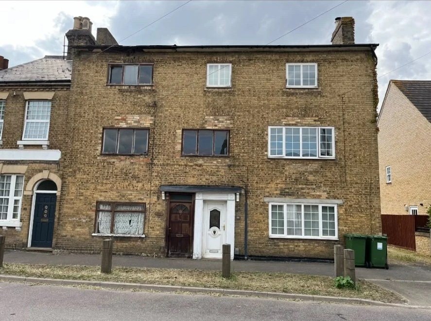 Tired brick front elevation before restoration at High Street, Willingham