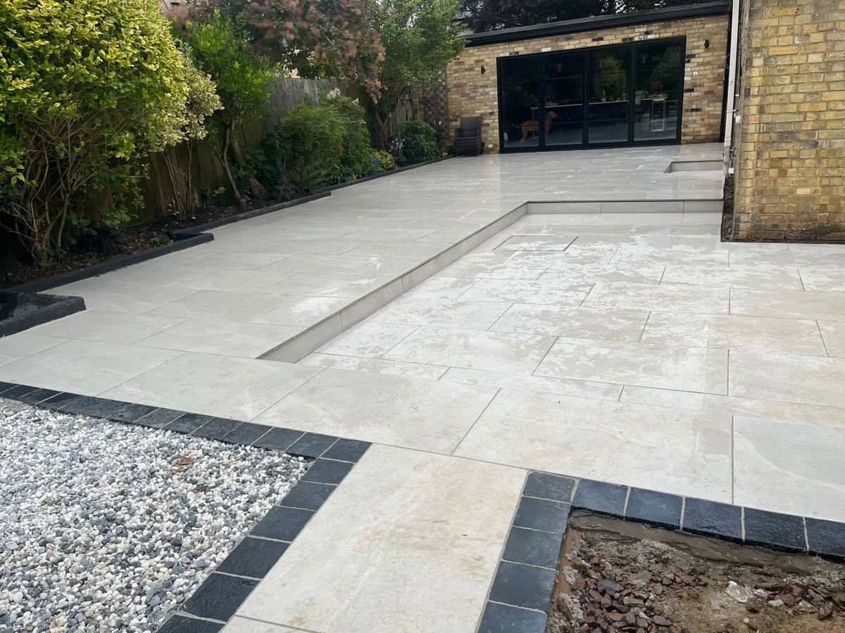 Porcelain paving with slate setts edging and gravel beds, High Street Warboys