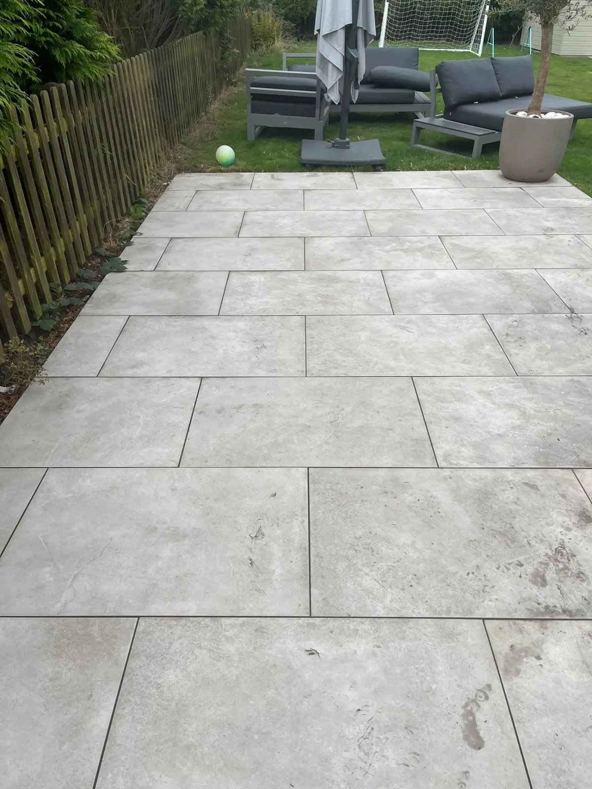 Large porcelain paved patio running along the rear garden, Warboys